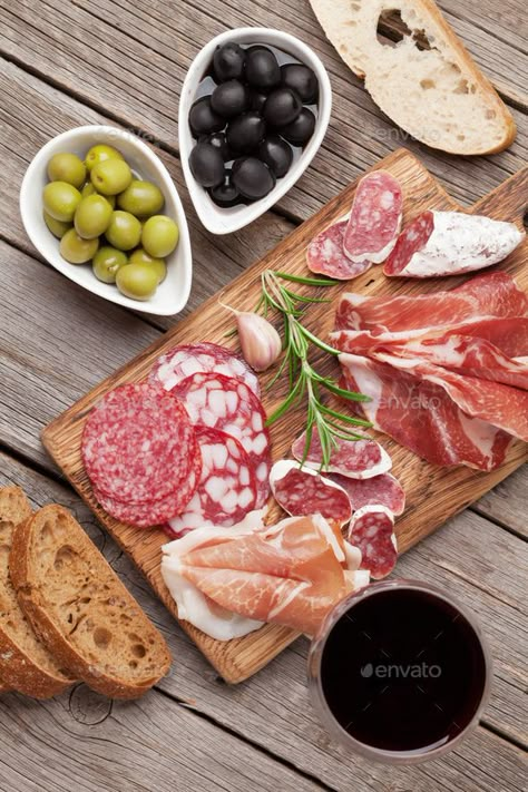 Salami, ham, sausage, prosciutto and wine by karandaev. Salami, sliced ham, sausage, prosciutto, bacon, toasts, olives. Meat antipasto platter and red wine on wooden table. ...#karandaev, #wine, #bacon, #sliced Antipasto Appetizer, Antipasto Platter, Wine And Cheese Party, Toast Toppings, Charcuterie Cheese, Charcuterie Platter, Party Food Platters, Charcuterie And Cheese Board, Cured Meats