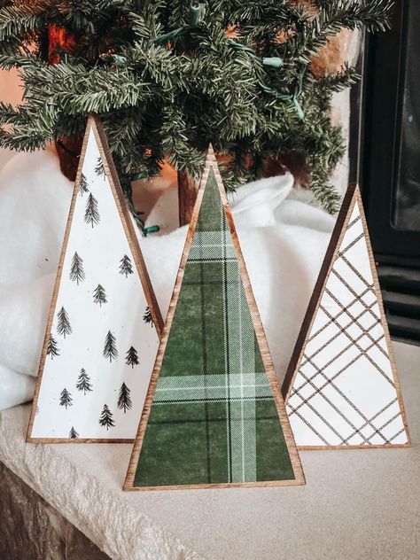 farmhouse style wooden trees. ahhh. they are so cute!❤️ these will be the perfect addition to mantle, wooden tray or your holiday decor. they also make the greatest gift. set includes 3 trees! (10", 9",  8")🌲 made in a smoke/pet free environment. they simple are the perfect decor. these are handmade so imperfections are always possible. Wooden Christmas Trees Green, Decorating Wood Christmas Trees, Christmas Trees Wooden, Cute Wood Crafts, Craft Fair Wood Projects, Small Wooden Christmas Crafts, Homemade Wooden Christmas Gifts, Wooden Winter Decor, Christmas Booth Display Ideas