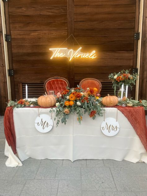 Fall sweetheart table simple & elegant #wedding #fall #terracotta #sweethearttable Fall Wedding Food Table Decor, Wedding Table With Pumpkins, Square Table Wedding Decor, Terracotta Wedding Ceremony Decor, Rectangle Head Table Wedding, Fall Sweetheart Table Wedding Decorations, Fall Wedding Sweetheart Table Decor, Fall Wedding Head Table Decorations, Fall Wedding Table Decor Pumpkins