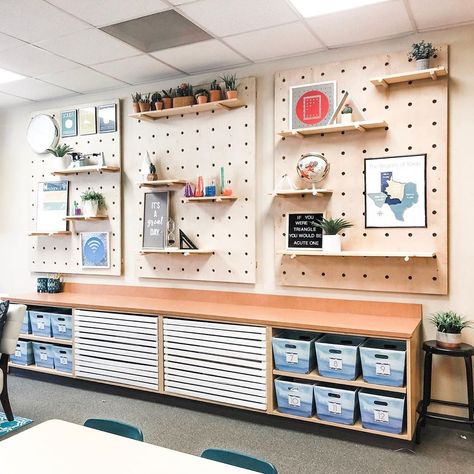 Megan Rowe on Instagram: “These pegboard shelves are one of the most asked about things in my classroom.  My husband built these for me, and they were definitely a…” Classroom Wall Shelves, Peg Board Ideas Classroom, Peg Board Classroom, Classroom Pegboard Ideas, Teacher Pegboard, Peg Board Classroom Ideas, Classroom Shelving Ideas, Pegboard Classroom, Classroom Cabinet Decor