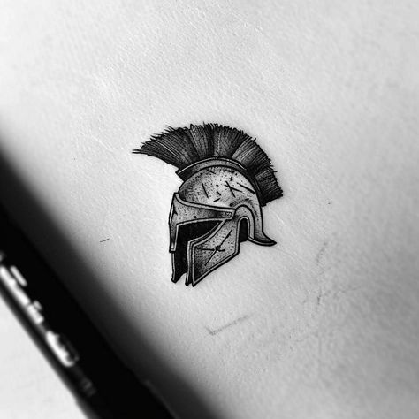 Dive into the legacy of courage and honor with this stunning Mandalorian helmet tattoo design. Embrace the warrior within and be inspired by the galaxy far, far away. Save this timeless piece and follow for more galactic wonders. Capturing the essence of resilience, this artwork symbolizes the journey of a lone warrior, carved in intricate shades of black and gray. Perfect for those who carry the spirit of adventure in their hearts. #MandalorianTattoo #StarWarsArt #Galactic Lone Warrior Tattoo, Mandalorian Helmet Tattoo, Warrior Helmet Tattoo, Helmet Tattoo Design, Black And Gray Tattoo Design, Mandalorian Tattoo, Lone Warrior, Helmet Tattoo, Mandalorian Helmet