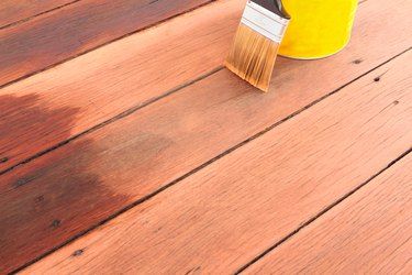 How to Remove Grease From a Wood Deck | eHow Deck Redo, Treated Wood Deck, Best Wood Stain, Deck Staining, Building A Floating Deck, Deck Maintenance, Exterior Wood Stain, Exterior Stain, Staining Deck