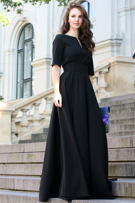 Black maxi dress with circle skirts. Golden color detail in neckline. Dress with lining, mid sleeves and zipper on the side.   ➤ Features > dress lenght: 156 cm / 61,4 > front bust pleats > mid sleeves > v neckline > pleats at skirt part > waistband  ➤ Sizing My Size Guide in FAQ section below will help you define the perfect size match. The item can also be made according to your measurements – just message them to me. ➤ Delivery Your item is made-to-order and will be ... Concert Dresses, Minimalist Dress, Black Party Dress, Gaun Fashion, Black Party Dresses, Minimalist Dresses, Black Women Fashion, Black Party, Women Maxi