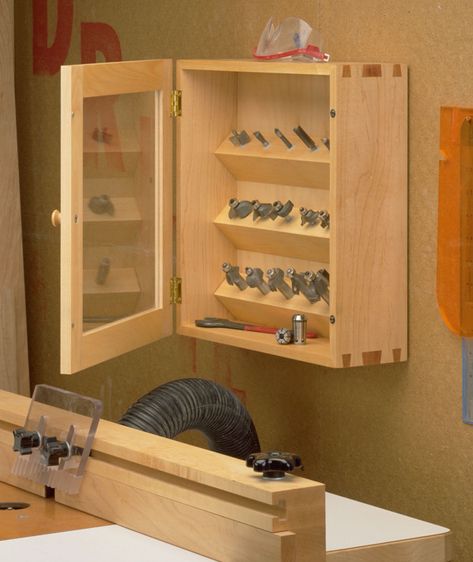 Router Bit Cabinet | Woodsmith Plans - Dovetail keys at the corners reinforce the joints to make a stronger cabinet. Plus, a clear plastic door panel lets you see what’s inside. Craftsman Tools Chest, Woodsmith Plans, Garage Workshop Plans, Cabinet Woodworking Plans, Router Lift, Wood Tool Box, Router Jig, Storage Center, Cabinet Plans