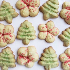 Spritz Cookies Christmas, Gluten Free Spritz Cookies, Buttery Spritz Cookies, Cookie Recipe Gluten Free, Gluten Free Christmas Baking, Butter Spritz Cookies, Spritz Cookie, Festive Holiday Desserts, Gluten Free Chocolate Cookies