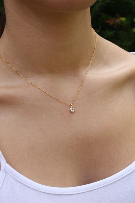 Tiny Drop Minimalist Necklace, Dainty Crystal Quartz Teardrop Pendant, Layering Everyday Jewelry, April's Birthstone, Gift for her, Silver This dainty and delicate layering necklace features a tiny clear crystal quartz teardrop bezel framed in your choice of gold filled or sterling silver. The petite pendant is suspended from a dainty chain in the finish of your choice. ...#Minimalist #of #Elegance #Jewelry #Jewelry #Embracing #Organizers #Art #Beauty #The #and #of #the #Exploring #Simplicity Small Dainty Necklaces, Pretty Dainty Necklaces, Simple Formal Jewelry, Dainty Jewelry Silver Necklace, Dainty Bridesmaid Jewelry, Simple Beautiful Necklaces, Simple Dainty Necklace, Minimalist Gold Pendant, Dainty Everyday Necklace