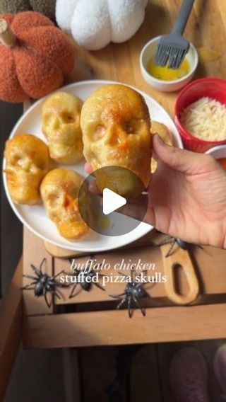 Peyton Pratte on Instagram: "Buffalo Chicken Pizza Skulls 💀 These are sooo good and fun for spooky season! Comment “spooky” and I’ll send you the link to the mold I used to make these! You can make regular pizza and so many other things in them! I’m doing puff pastry + strawberry filling next 🍓

Recipe: 
2 cups cooked chicken (shredded or cut into cubes, whatever texture you like) 
1/2 cup buffalo sauce 
2 cups mozzarella cheese 
2 containers of store bought pizza dough (or you can make your own of course!) 

Instructions:
Preheat your oven to 375F 
Spray the skull mold with cooking spray, making sure to grease it well 
Roll your pizza dough out and cut into 12 even rectangles. 
In a small bowl, mix together the chicken & buffalo sauce 
Add one rectangle of pizza dough to the skull mold, Skull Mold Recipes, Pizza Skulls, Peyton Pratte, Chicken Buffalo, Store Bought Pizza Dough, Pizza Roll Up, Halloween Charcuterie, Chicken Shredded, Chicken Pumpkin