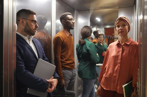 Contemporary Business People in Elevator by seventyfourimages. Multi-ethnic group of business people standing in elevator with door open, focus on young woman in foreground, copy s... #Sponsored #ethnic, #Multi, #business, #group Elevator Reference, People In Elevator, Group Photo Poses, Band Photoshoot, Door Open, A Vision Board, Business People, Group Photo, People Standing