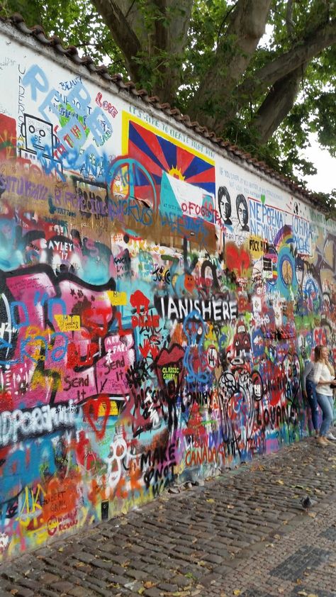 The john Lennon wall prague John Lennon Wall Prague, Jhon Lennon, Lennon Wall, John Lennon Wall, Ariel Disney, Disney Ariel, Vacation Travel, John Lennon, Travel Aesthetic