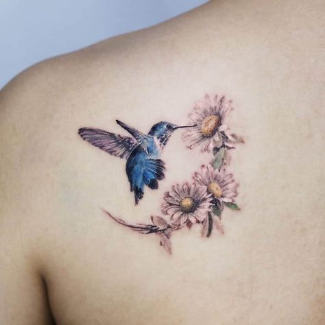 Hummingbird Tattoos: Meanings, Tattoo Designs & Ideas Hummingbird Tattoo Meaning, Hummingbird Flower Tattoos, Bird And Flower Tattoo, Small Hummingbird Tattoo, Flower Tattoo Meanings, Daisy Tattoo, Hummingbird Flowers, Sunflower Tattoos, Hummingbird Tattoo