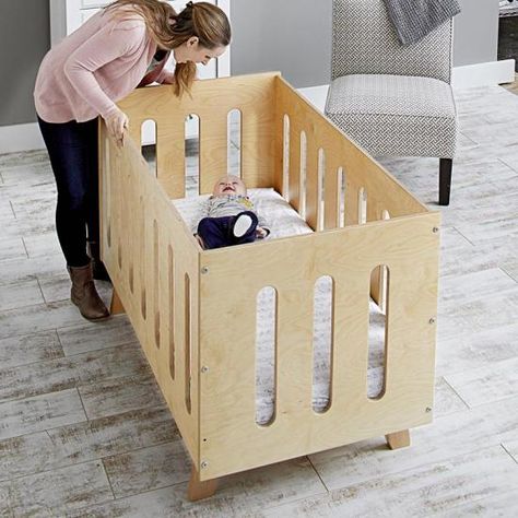 This bed/crib combo adapts to a growing child's needs and knocks down for storage. Simple plywood panels secured with knock-down fasteners make this bed fast to build, set up, and break down. Start with the crib, and when your child is old enough, swap in the toddler panel. It allows a little one to get in and out on their own, while preventing them from rolling out. When they outgrow the toddler bed, everything disassembles for storage in minimal space. Convertible Crib Plans, Boy Girl Bedroom Ideas, Nursing Table, Wooden Baby Crib, Crib Woodworking Plans, Crib Diy, Baby Crib Diy, Modern Cottage Style, Wood Crib