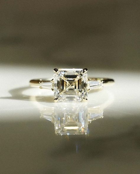 Asscher Cut Three Stones DEF VVS Diamond Moissanite Engagement Ring 10K 14K 18K Real Gold Ring Asscher Cut Moissanite Engagement Ring ✥ 𝐌𝐚𝐢𝐧 𝐒𝐭𝐨𝐧𝐞 𝐃𝐞𝐭𝐚𝐢𝐥𝐬 ↣ Shape: Asscher Cut / Moissanite  ↣ Type: Lab Grown ↣ Weight: 3.00 Ct (App.) ↣ Color: F + ↣ Clarity: VS1 + ✥ 𝐒𝐢𝐝𝐞 𝐒𝐭𝐨𝐧𝐞 𝐃𝐞𝐭𝐚𝐢𝐥𝐬 ↣ Shape:  Tapered Baguette ↣ Type: Lab Grown /Moissanite  ↣ Weight: 0.50Ct (App.) ↣ Color/Clarity: F+ / VS1+ ✤ 𝐑𝐢𝐧𝐠 𝐃𝐞𝐭𝐚𝐢𝐥𝐬   ↦ Metal Purity: Solid Gold (10KT, 14KT, 18KT) ↦ Baguette Wedding Rings, Asscher Engagement Ring, Asscher Cut Ring, Ring Three Stone, Vvs Diamond, Asscher Cut, Green Diamond, Platinum Metal, Anniversary Gift For Her