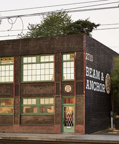 7 Warehouse Conversions: Turning Industrial Buildings Into Modern Commercial Spaces - Photo 10 of 13 - Painter Jocelyn Rahm and furniture reclaimer Robert Rahm set up Beam & Anchor—a workshop and retail space for furniture craftsmen—in a two-level Portland warehouse. Warehouse Apartments, Warehouse Renovation, Industrial Exterior, Warehouse Living, Warehouse Conversion, Brick Siding, Warehouse Design, Storefront Design, Building Renovation