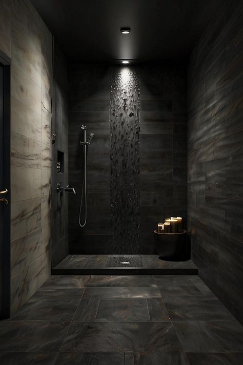 Dive into the allure of modern gothic design with this stunning bathroom retreat! The sleek frameless glass shower panels reveal a striking interior adorned with luxurious black stone tiles, perfectly complemented by a waterfall showerhead that invites relaxation. The clean lines and understated decor create an atmosphere of dark elegance, where form meets function seamlessly. 🖤🚿 #ModernGothic #BathroomInspo #DarkElegance Black Stone Tile, Glass Shower Panels, Nyc Penthouse, Dream Shower, Modern Gothic, Bathroom Retreat, Dark Elegance, Stunning Bathrooms, Gothic Design