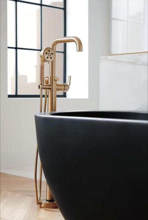 Pops of gold. Floor Mount Tub Filler, Black Tub, Gold Faucet, Freestanding Tub Filler, Bathroom Showrooms, Gold Fixtures, Steam Showers Bathroom, Modern French, Freestanding Tub