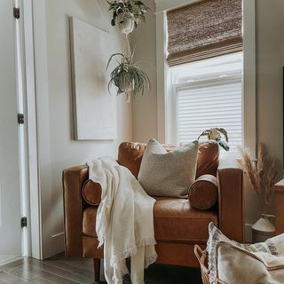 Budget Blinds Official (@budget_blinds_official) • Instagram photos and videos Chair Next To Fireplace Ideas, Cozy Leather Chair, Chair Next To Fireplace, Reading Chair Corner, Tan Chair, Budget Blinds, Woven Wood Shades, Tufted Leather, Cozy Lounge