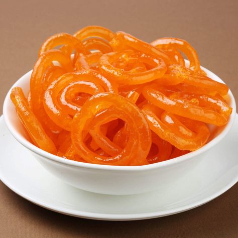 Easy Jalebi Recipe: Make the easy and delicious jalebi recipe at home using ingredients like purpose flour, baking soda, corn flour, sugar, ghee, saffron, edible food color and more on Times Food Jalebi Recipe, Most Popular Desserts, Single Recipes, Evening Snacks, Indian Desserts, Indian Sweets, Super Easy Recipes, Recipe Steps, Indian Food Recipes