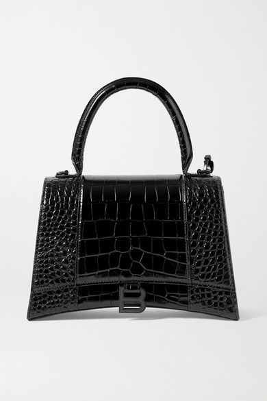 Shop Balenciaga Hourglass Croc-effect Leather Tote In Black from 250+ stores, starting at $1790. Similar ones also available. On SALE now! Balenciaga's tote has a curved base that mirrors the shape of the label's signature ['Hourglass' id1199765] silhouette. Crafted in Italy from black croc-effect leather, it has a tonal logo plaque and opens to a spacious interior with a separate zipped compartment for your cards and keys.Wear it with: [Balenciaga Blazer id1199765], [Balenciaga Skirt ... Balenciaga Mini Bag, Balenciaga Tote, Black Balenciaga, Balenciaga Women, Balenciaga Black, Cheap Bags, Balenciaga Bag, Handbag Straps, Crossbody Tote