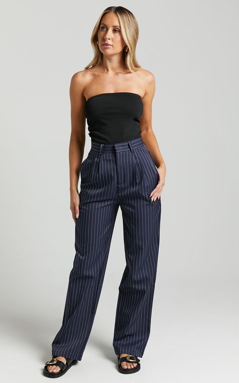 Add a touch of sophistication to your workwear wardrobe with our Iyah Pants in Navy Pinstripe. These high-waisted, tailored pants are designed to flatter your figure while keeping you looking chic and stylish all day long. Made from comfortable polyester fabric, these full-length pants will take you effortlessly from the office to after-work drinks. Dress them up with heels and a blouse for a professional look or pair them with sneakers and a casual top for an elevated everyday ensemble. Upgrade Navy Blue Pinstripe Pants Outfit, Elevated Game Day Outfit, Navy Pinstripe Trousers Outfit, Navy Striped Pants Outfit, How To Style Striped Pants, Navy Pinstripe Pants Outfit, Casual Dress Pants Outfits, Blue Pinstripe Pants Outfit, Summer Casual Work Outfits For Women