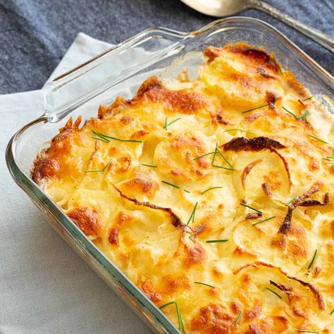 Australian Cheesy Potato Bake | Wandercooks Traditional Australian Food, Creamy Cheesy Potatoes, Potato Bake Recipe, Cheesy Potato Bake, Panini Recipes Chicken, Chicken Panini, Fried Spring Rolls, Potato Bake, Cheesy Potato