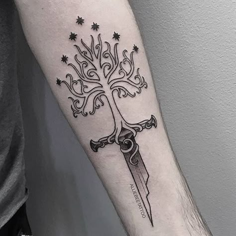 Made by @alliebeetattoo 🙏🙏 "Dane wanted Narsil merging with the Tree of Gondor, I had creative freedom with how it was executed. Thank you for the trust! ⚔️" . . . . #utah #utahartist #slc #slcart #slcartist #ink #illustration #illustrator #illustrativeart #tattoo #slcink #slctattoo #utahtattoo #utahtattooartist #utahtattoos #slctattoos #slctattooartist #minimaltattoo #linetattoo #linework #illustrativetattoo #lineworktattoo #lotrtattoo #lotr #tolkientattoo #narsil #gondor #blackworktattoo #bl Lord Of The Rings Design, Tree Of Gondor Tattoo, Tolkien Tattoo, Ring Tattoo Designs, Tree Of Gondor, Lotr Tattoo, Lord Of The Rings Tattoo, Nerdy Tattoos, Tattoo Neck