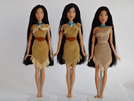 Comparing three different Pocahontas 12'' dolls from the Disney Store.  From left to right they are:  2011 10-Pack Pocahontas , from the 2011 Disney Princess Classic Film Collection 10 Doll Set.  2012 10-Pack Pocahontas , from the 2012 Disney Princess Classic Film Collection 10 Doll Set. 2012 Classic Pocahontas Doll, from the 2012 Disney Princess Classic Doll Collection.  The middle doll, 2012 10-Pack Pocahontas , is a combination of the other two.  She has the face of the 2012 Classic doll, but Pocahontas Doll, Pale Pink Lips, Pink Lip Color, Film Collection, Straight Black Hair, Suede Shorts, Doll Set, Disney Dolls, Doll Collection