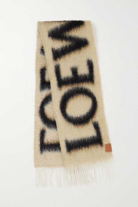 Loewe's scarf is knitted with wool and mohair for a warm, cozy handle. Designed in an oversized shape, it's patterned with the brand's logo in contrasting colors to create an eye-catching 3D effect and trimmed with swishy fringing. Stockholm Wishlist, Loewe Clothes, Scarf Print Pattern, Loewe Scarf, Cute Scarves, Loewe Fashion, Apres Ski Outfits, Nyc Winter Outfits, Apres Ski Style