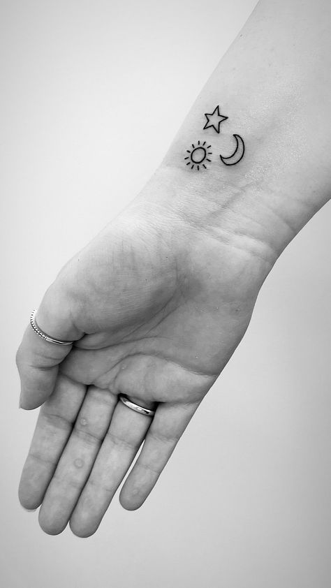 Sun moon stars small wrist tattoo Sun Moon Star Hand Tattoo, Sun Moon Star Tattoo Small Simple, Simple Sun Moon Star Tattoo, Simple Sun Moon And Stars Tattoo, Moon And Star Wrist Tattoo, Metaphor Tattoo, Star And Sun Tattoos, Tattoo Sun Moon Stars, Small Moon And Star Tattoo