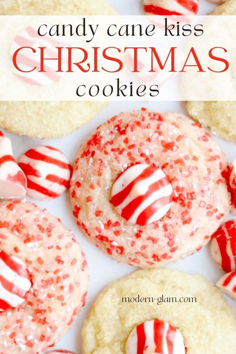 Christmas cookies recipe. Make these nut-free version of the popular Peanut Blossoms. White chocolate candy cane kisses dot yummy sugar cookies flavored with peppermint and rolled in colored sugar for the perfect christmas cookie recipe. Kiss Christmas Cookies, Holiday Dessert Drinks, Peanut Blossom Cookies, Candy Cane Cookie Recipe, Cranberry Orange Cookies, Cookies With White Chocolate, Chewy Molasses Cookies, White Chocolate Candy, Christmas Cookies Gift