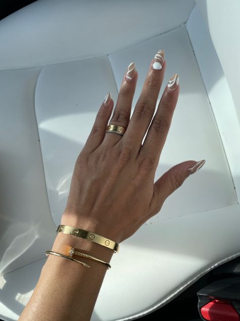 Hand wearing beautiful pieces from luxury jewelry brand cartier Juste En Clou Ring, Cartier Bracelet And Ring, Just En Clou Ring, Love Ring Cartier, Cartier Love Ring And Bracelet, Classic Cartier Gold Bracelet Gift, Cartier Love Ring Stack, Cartier Bracelet Nail, Just En Clou Bracelet