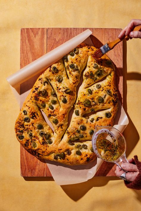 Puffy, oil-rich focaccia gets a lot of love from home bakers. But its leaf-shaped French cousin fougasse is every bit as delicious, just as easy to bake, and maybe even more impressive. You can use instant yeast or active-dry in this bread recipe, which means you can bake it no matter which you keep on hand. The fougasse dough comes together in one bowl, and the only equipment you’ll need is a spatula and a bench scraper. However, you will need some time. Here's how to make homemade fougasse. No Knead Fougasse, Bon Appetit No Knead Focaccia, Fougasse Recipe, Fougasse Bread, Baking Breads, Bowl Scraper, Sides Dishes, Pizza Wheel, Olive Relish