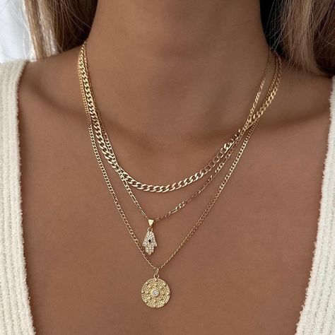 FINAL SALE. NO EXCHANGES OR RETURNS Gorgeous Hamsa necklace with encrusted cubic zirconia details. Perfect to wear alone or layer with other necklaces. 14k Gold Filled Chain 14k Gold Filled Charm Charm: 14.6mm x 7.9mm Chain length: 18" Chain Diameter: 2.5mm Lobster clasp closure Hypoallergenic Water resistant & tarnish free Nickel & lead free Additional discount codes do not apply to sale items Layering Gold Necklaces, Layered Necklaces Gold, Necklace With Charms, Stackable Necklaces, Hamsa Necklace, Stacked Necklaces, Jewelry Fashion Trends, Jewelry Essentials, Stacked Jewelry