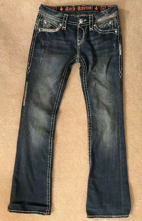 EUC! Womens Rock Revival Sasha Boot Jeans Sz 26 cool style! great fit Waist measures 30 inches Inseam measures 32 inches *Were hemmed with sticky tape that is still a little bit on inside (should come off over time)( see last picture ) Emo Jeans, Early 2000s Outfits, New Rocks, Robin Jeans, 2000s Outfits, Cargo Pants Outfit, Rock Revival Jeans, Boot Jeans, Sneakers Outfit