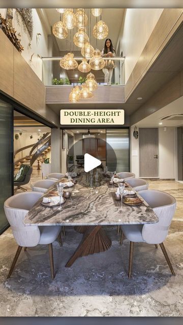 Originally there were none double height space which could connect both levels but by providing a cutout above the dining both levels wer... | Instagram Dining Double Height, Double Height Dining Area, Wooden Fluted Panel, Double Height Space, Prashant Parmar, 2023 Photography, Fluted Panel, Luxurious Penthouse, Double Height