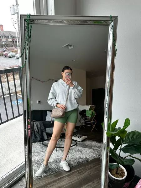 Cozy spring outfit idea! Featuring a workout set and loungewear essentials I’m wearing a M hoodie, size L set and size 9 sneakers #LTKunder100 #LTKfit #LTKSeasonal Sage Green Biker Shorts Outfit, Green Biker Shorts Outfit, Oversized Jacket Outfit, Green Biker Shorts, Cozy Spring Outfits, Casual Neutral Outfits, Spring Outfit Idea, Gucci Runway, Biker Shorts Outfit