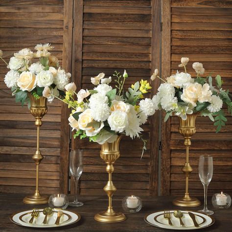 PRICES MAY VARY. Quantity: 3 Flower Vase Centerpieces (Assorted Sizes) Material: Metal Color: Metallic Gold Style: Vintage Style Trumpet Flute Vase Small Vase Height: 12.5" Medium Vase Height: 15.5" Large Vase Height: 18.5" Top Diameter: 5" Base Diameter: 4.75" Depth: 4.25" Pole Diameter: 10mm Assembly Required: Yes. Easy to Assemble. Perfect for both flowers and candles or as a great wedding table centerpiece. HIGH QUALITY: These candle holders are made from high-quality premium material. To ma Trendy Vases, Flute Table, Gold Vase Centerpieces, Everyday Table Decor, Metal Vases, Trumpet Flower, Tall Wedding Centerpieces, Gold Centerpieces, Fluted Vase