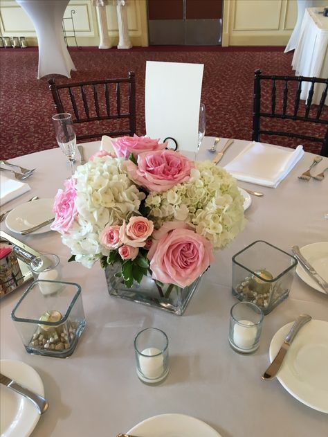 Hydrangea And Spray Rose Centerpiece, Centerpiece With Hydrangea, Simple Hydrangea Centerpiece Wedding, Simple Roses Centerpieces, Pink And White Hydrangea Centerpiece, White Hydrangea With Pink Roses Centerpiece, Light Pink And White Flower Arrangements, Simple Pink Flower Centerpieces, Small Hydrangea Centerpiece