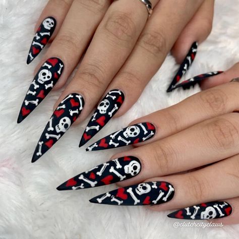 This V-day Nail Set by @clutchcityclaws is giving Y2K Myspace background and we love it!! 💀❤️💀❤️💀❤️ ↓↓ : ★ TOOFAST.COM ★⁠ : : ★ #houstonnails #houstonnailtech #dopenailgalleria #texasnails #nailedit #nails #nailart #nailsofinstagram #naildesigns #houston #nailpro #gelx #naildesign #nail #nailsaddict #nailsmagazine #nailsoftheday #nails2inspire #nailstagram #nailartist #nailporn #nailstyle #nailsofhouston #instanails #claws #blingnails #chromenails #nailsoftexas #tsrclawz Curved Nails Designs, Y2k Myspace, Valentines Skull, Pirate Nails, Gothic Nail Art, Hearts And Bones, Texas Nails, 2022 Nails, Sharp Claws