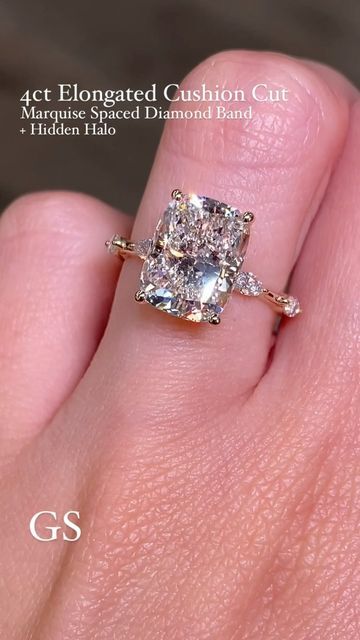 Golden String Inc on Instagram: "Finally posting this combo on the feed❤️‍🔥 This soft elongated cushion cut diamond was paired with our fav spaced marquise band and of course a hidden halo 😉   •4ct Elongated Cushion Cut on our Marquise Spaced Diamond Band + Hidden Halo 💎  The rings on our feed are custom therefore aren’t listed on our website! The best way to order is through DM, Email, or Phone. Available in both Natural and Lab Diamond  -Please Message All Price Inquiries✨  #radiantengagementring #radiantsolitairering #hiddenhaloengagementring #radianthiddenhalo  #cushioncutdiamond #cushioncutsolitaire #2caratdiamond #2carat #radiantcutdiamond #elongatedcushion #elongatedcushioncut #engagementring #cushioncutdiamond #yellowgoldradiant #labdiamondengagementring #labdiamond #radiantlabg Elongated Cushion Cut Engagement Ring Halo, Elongated Cushion Engagement Ring 5ct, Elongated Cushion With Hidden Halo, Spaced Diamond Band, Elongated Cushion Engagement Ring, Elongated Cushion Cut Engagement Ring, Marquise Band, Cushion Cut Solitaire, Elongated Cushion Cut