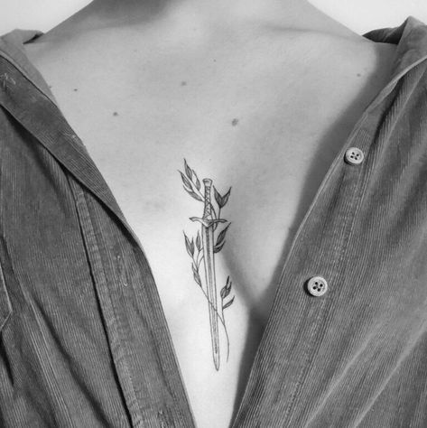 210+ Best Sword Tattoo Designs With Meanings (2022) - TattoosBoyGirl Swords Sternum Tattoo, 96 Tattoo, Women Sternum Tattoo, Witcher Tattoo, Look Attractive, Dagger Tattoo, Sternum Tattoo, Tattoo Designs And Meanings, Abstract Tattoo