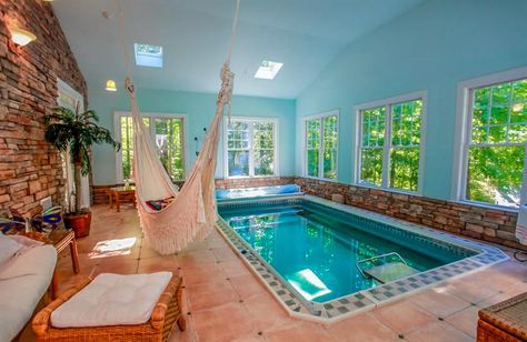 Earth and ocean tones define this gorgeous sunroom with a fully in-ground Original Endless Pool. After your swim, the macrame hammock awaits. Sunroom With Pool, Indoor Swim Spa, Underwater Pool Light, Endless Pools, Indoor Pool House, Swimming Pool Pictures, Pool Indoor, Inside Pool, Swim Spas