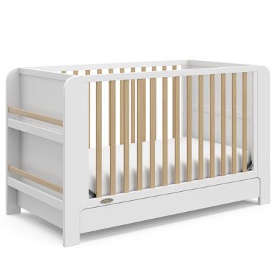 Transform your nursery with the Graco Read-with-Me 4-in-1 Convertible Crib with Drawer, featuring two detachable bookshelves that adapt to your child's growing stages. These versatile bookshelves continue to organize your little one's books even after they outgrow the crib, making it a lasting addition to any space. Crafted from pine wood and engineered wood, the Read-with-Me meets ASTM and CPSIA safety standards, providing peace of mind for parents. JPMA Certified, it undergoes rigorous testing by accredited laboratories to exceed safety standards. Engineered to grow with your baby, the Read-with-Me features an adjustable mattress support base with four height options, ensuring safety and comfort as your child grows up to 35 inches in height or can climb out independently. The Read-with-M Crib With Storage, Adjustable Mattress, Mattress Support, Convertible Crib, Crib Mattress, Baby Crib, Baby Cribs, 4 In 1, Storage Drawers