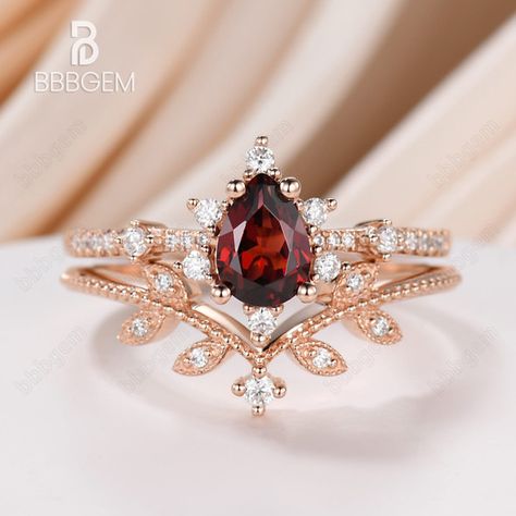 Luxury Red Crystal Engagement Ring, Luxury Red Ring Jewelry, Luxury Ruby Wedding And Engagement Ring With Accent Stones, Luxury Elegant Garnet Ring, Luxury Romantic Ruby Ring, Luxury Red Wedding Rings, Luxury Fine Jewelry Red Rings, Luxury Gold Wedding And Engagement Sets For Valentine's Day, Luxury Red Wedding And Engagement Fine Jewelry