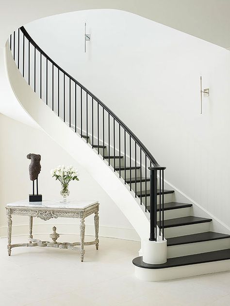 Staircases do more than connect levels in your home; their visual presence is an architectural statement. From spiral staircases to sleek wood designs, find beautiful staircase designs to complement your style. White Foyer, Classic Staircase, Stair Rails, Modern Stair Railing, Iron Stair Railing, Wrought Iron Stairs, Stair Railing Design, Staircase Makeover, Stair Case