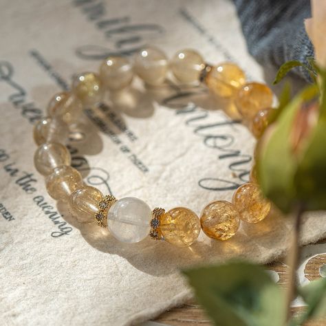 ✨ Elevate your energy with our stunning Citrine and Golden Rutilated Quartz bracelet! 🌟 Known for attracting abundance and amplifying positivity, this radiant duo enhances clarity, boosts motivation, and brings prosperity to your journey. 💛 Embrace the power of these vibrant crystals and let your light shine bright! ✨ Which energy do you want to amplify with this bracelet? #crystal #crystals #crystalhealing #crystallove #crystalshop #crystaljewelry #abundance #citrine #rutilatedquartz #... Spiritual Citrine Crystal Bracelet With Natural Stones, Spiritual Citrine Gemstone Beaded Jewelry, Spiritual Healing Citrine Bracelet, Luxury Citrine Gemstone Beads Jewelry, Luxury Elegant Citrine Bracelet, Attracting Abundance, Golden Rutilated Quartz, Let Your Light Shine, Quartz Bracelet