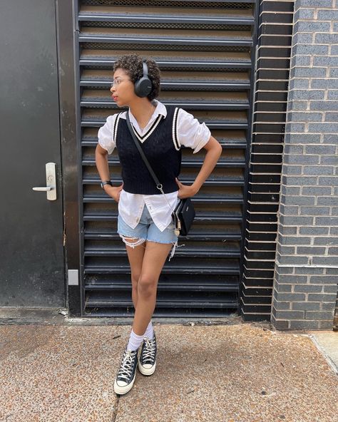 Girl in Black crocheted vest, sony headphones, white dress shirt, black band apple watch, steve madden, boyfriend shorts, converse, natural makeup look, cafe outfit posing. Sweater Vest Outfit With Shorts, Sweater Vest Outfit, Grad Outfits, Fall Vest, Crochet Vest, Vest Outfits, Outfit Inspo Fall, Dope Outfits, Sweater Vest