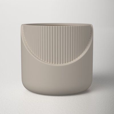 The simple lines showcase its cut-out pattern, called out by a clean white glaze. Size: 5" H x 5.5" W x 5" D | AllModern Ceramic Table Vase Ceramic in Gray, Size 5.0 H x 5.5 W x 5.0 D in | Wayfair Wood And Ceramic, Contemporary Vases, Vase Ceramic, Id Design, Grey Ceramics, Table Vase, Hot Nails, Table Vases, Ceramic Vases