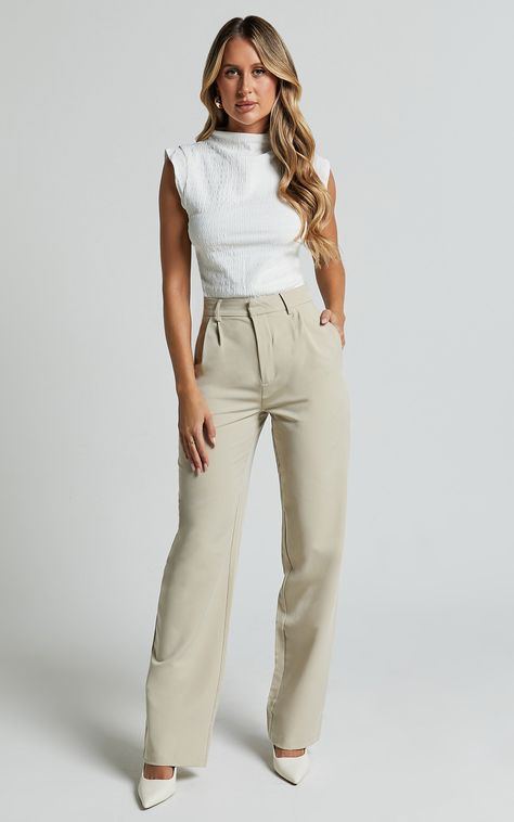 Get ready to elevate your workwear game with the Brionne Top. This high-neck, cap-sleeve top in classic white is a must-have addition to your fashion tops collection. Made from 100% polyester, it offers a sleek and stylish look that meets the highest standards of style and comfort. Whether you're heading to the office or meeting up with friends after work, this versatile top is perfect for any occasion. Pair it with tailored pants or a chic skirt for an effortlessly polished look that will make Clean Girl Outfits For Work, Service Advisor Outfits, Nursing Conference Attire, Architecture Presentation Outfit, Effortless Pants Aritzia Outfit Work, Spring Outfits For Work Office Style, Women’s Business Wear, Modern Women Outfits, Women’s Buisness Casual