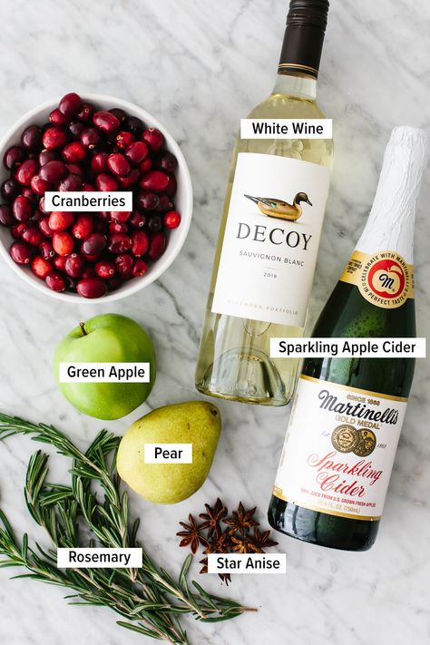 This white Christmas sangria sparkles with seasonal colors, is splashed with apple cider, and turns white wine into the best holiday drink! White Christmas Sangria, Holiday Sangria, Christmas Sangria, Holiday Beverages, Sparkling Cider, Holiday Drink, Mixed Drinks Recipes, Sangria Recipes, Christmas Brunch