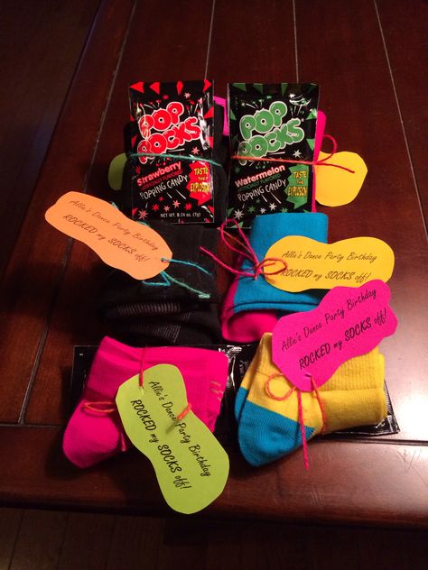 Dance party birthday favor. A pair of socks wrapped with pop rocks. Tag says "Allie's Dance Party Birthday ROCKED my SOCKS off!" Birthday Party Dance Theme, Dance Party Food Ideas, Dance Team Party Ideas, Sock Party, Dance Party Favors, Neon Dance Party, Dance Birthday Party, Neon Dance, Jive Dance